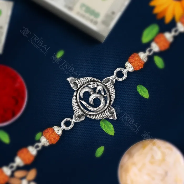 TRIBAL ORNAMENTS Bracelets Exclusive style Aum or OM Mantra 925 sterling silver Rakhi bracelet in rudrakshblack basilwhite basil and silver beaded chain rk267 TRIBAL ORNAMENTS Bracelets Exclusive style Aum or OM Mantra 925 sterling silver Rakhi bracelet in rudrakshblack basilwhite basil and silver beaded chain rk267